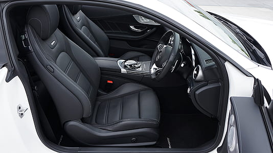 opened white and black vehicle interior during daytime thumbnail