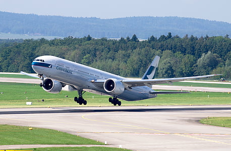 gray airliner about to take off thumbnail