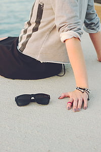 person sitting on concrete pavement thumbnail