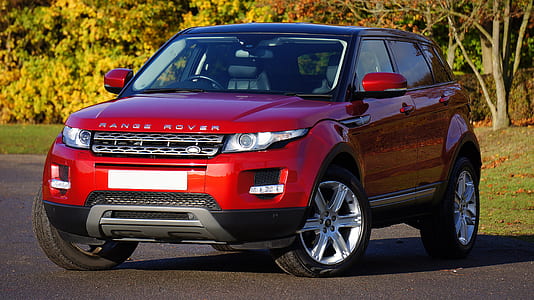 red Range Rover Evoque SUV on road thumbnail
