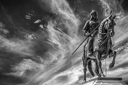 grayscaled photo of man riding horse statue thumbnail
