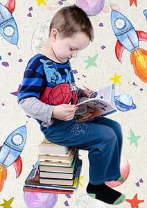 boy sitting on book and reading book thumbnail