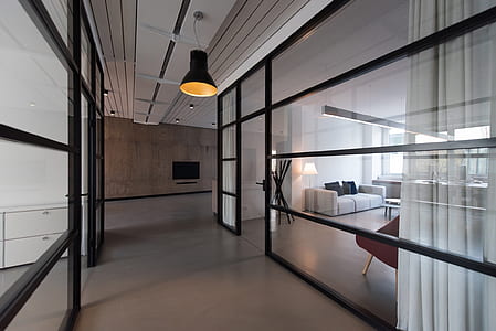 black pendant lamp between glass panel walls thumbnail