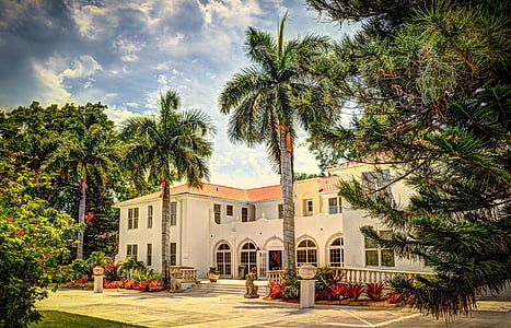 gray and orange house and trees thumbnail