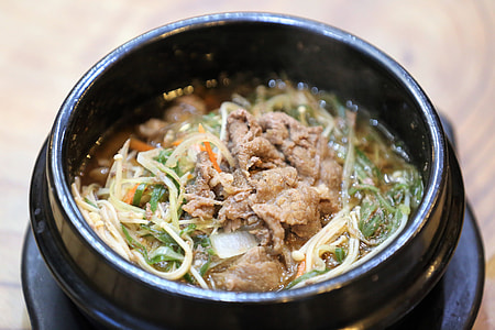 noodle soup on black ceramic bowl thumbnail