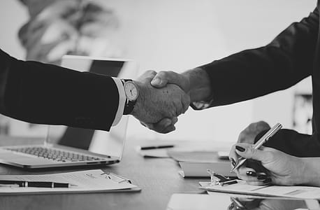 Grayscale Photo of Person's Shake Hands thumbnail