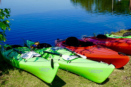 five kayaks docked near body of water thumbnail
