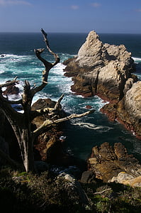 stone formation on body of water thumbnail