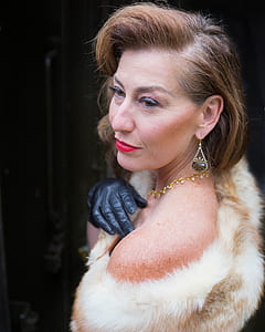 woman wearing beige fur coat thumbnail