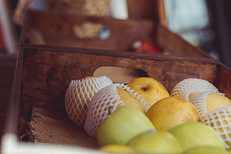 green and yellow apple fruits on brown wooden crate thumbnail