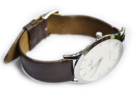 round silver-colored analog watch with brown strap thumbnail
