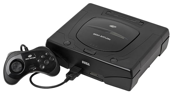 black Sega game console with controller thumbnail