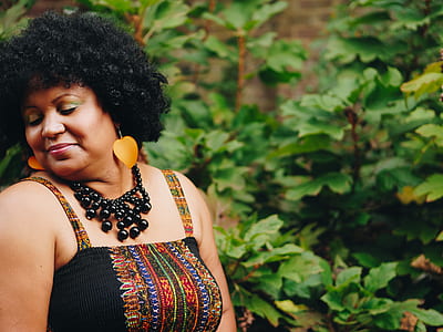 woman standing near plants thumbnail