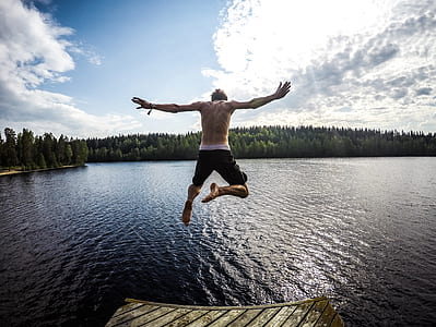 man jumping to the body of water thumbnail