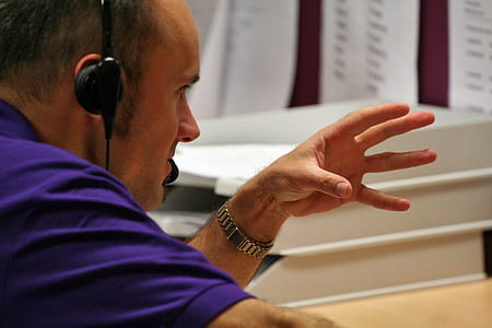 man in purple top doing hand gesture thumbnail