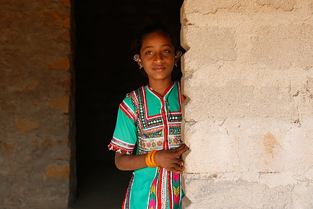 girl in teal and multicolored dress thumbnail
