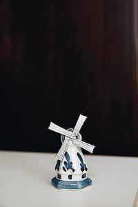 white and blue windmill miniature on table thumbnail