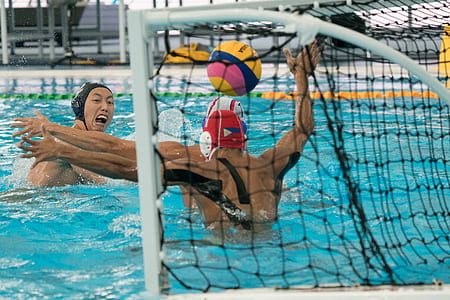 group of men playing soccer game in pool thumbnail