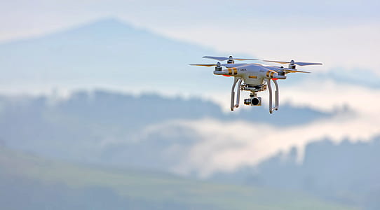 white and red DJI drone in mid air thumbnail