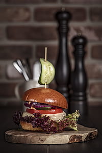 burger on brown wooden tray thumbnail