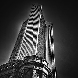 grayscale and low-angle photography of high-rise building thumbnail