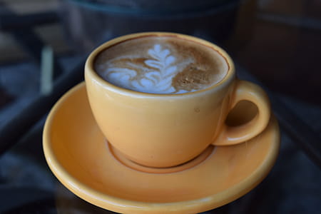 Coffee Latte on Brown Ceramic Cup and Platter thumbnail