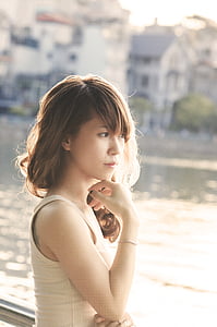 woman wearing white spaghetti-strap top thumbnail