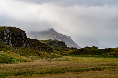 mountains under white clouds during daytime thumbnail