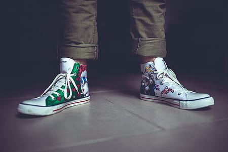 person wearing white high-top sneakers thumbnail
