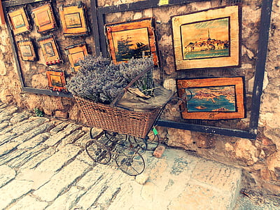 brown wicker bassinet stroller besides photo frames thumbnail