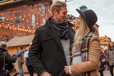 Happy Couple Under Holiday Lights Photo thumbnail