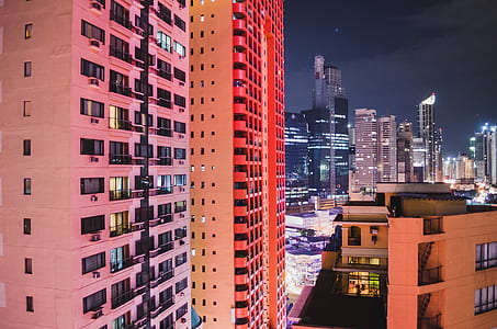 aerial photography of city buildings at night time thumbnail