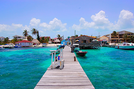 boat beside brown wooden dock thumbnail