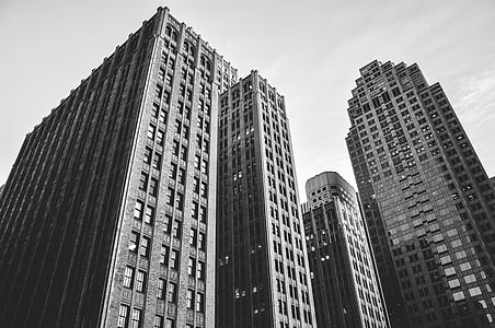 grayscale photography of high-rise buildings thumbnail