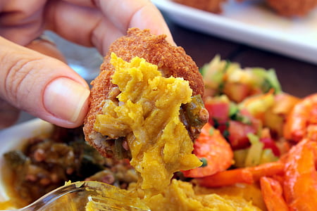 person holding fried meat thumbnail