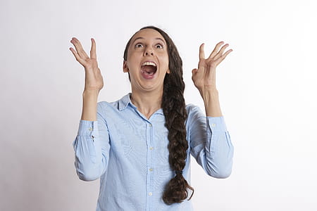 woman in blue dress shirt with surprised expression thumbnail