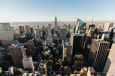 city buildings under blue sky photography thumbnail