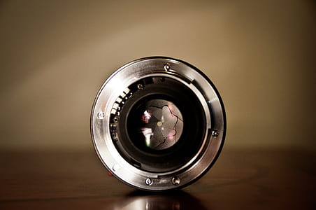 round silver-colored camera lens thumbnail