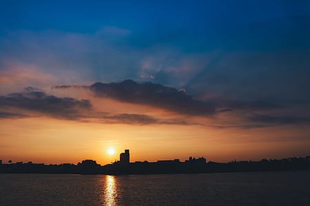 Silhouette of City Buildings during Sunset thumbnail