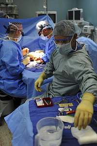 three doctors during medical operation thumbnail