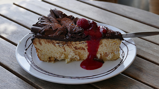 caked with berries on toppings on plate thumbnail