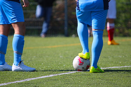 man stepping ball on field thumbnail