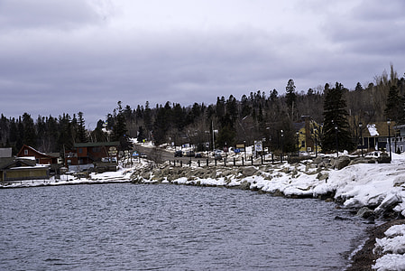 Winter shoreline and pine forest in Grand Marais, Minnesota thumbnail