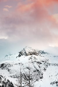 snow-covered mountain under cloudy sky thumbnail