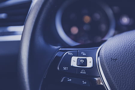 selective focus photography of car steering wheel thumbnail