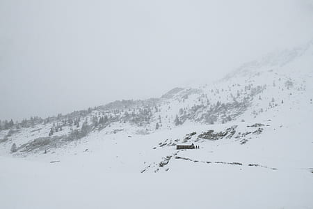mountain range covered in snow thumbnail