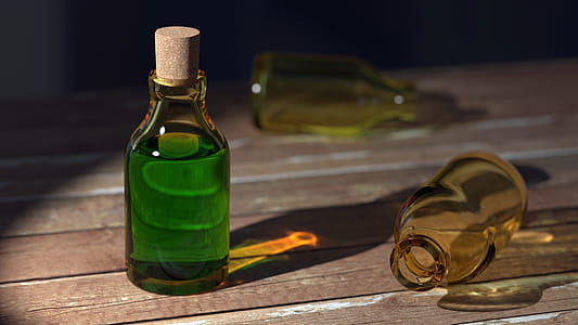 Green Liquid on Clear Glass Bottle With Cork thumbnail