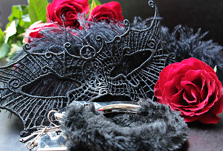 black mask beside red rose thumbnail