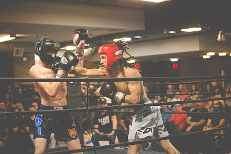 two boxing player fighting on ring thumbnail