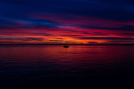 silhouette of boat during golden hour thumbnail